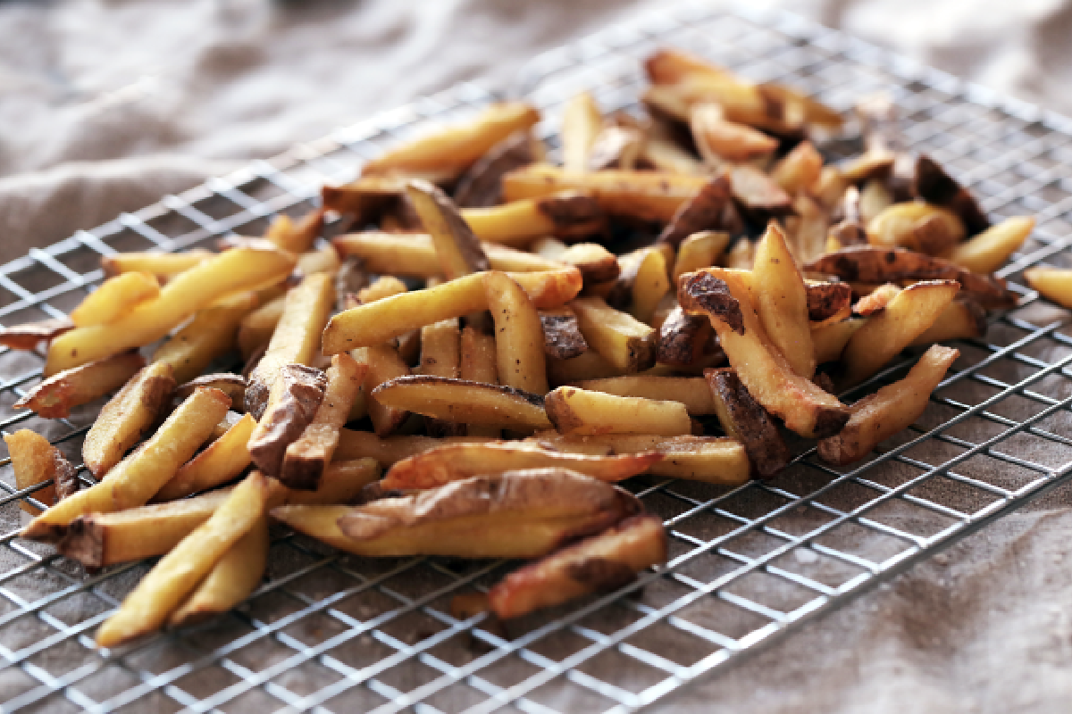 Seasoning frozen fries for air frying with herbs and spices