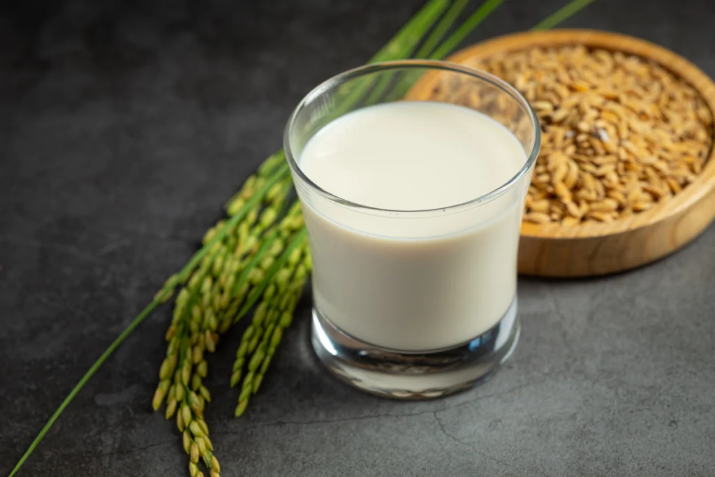 Assortment of alternative dairy solutions including almond milk, soy milk, and oat milk.